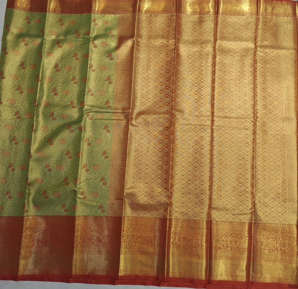 Pistachio Green Meenakari Pattu Saree with Copper Orange Border